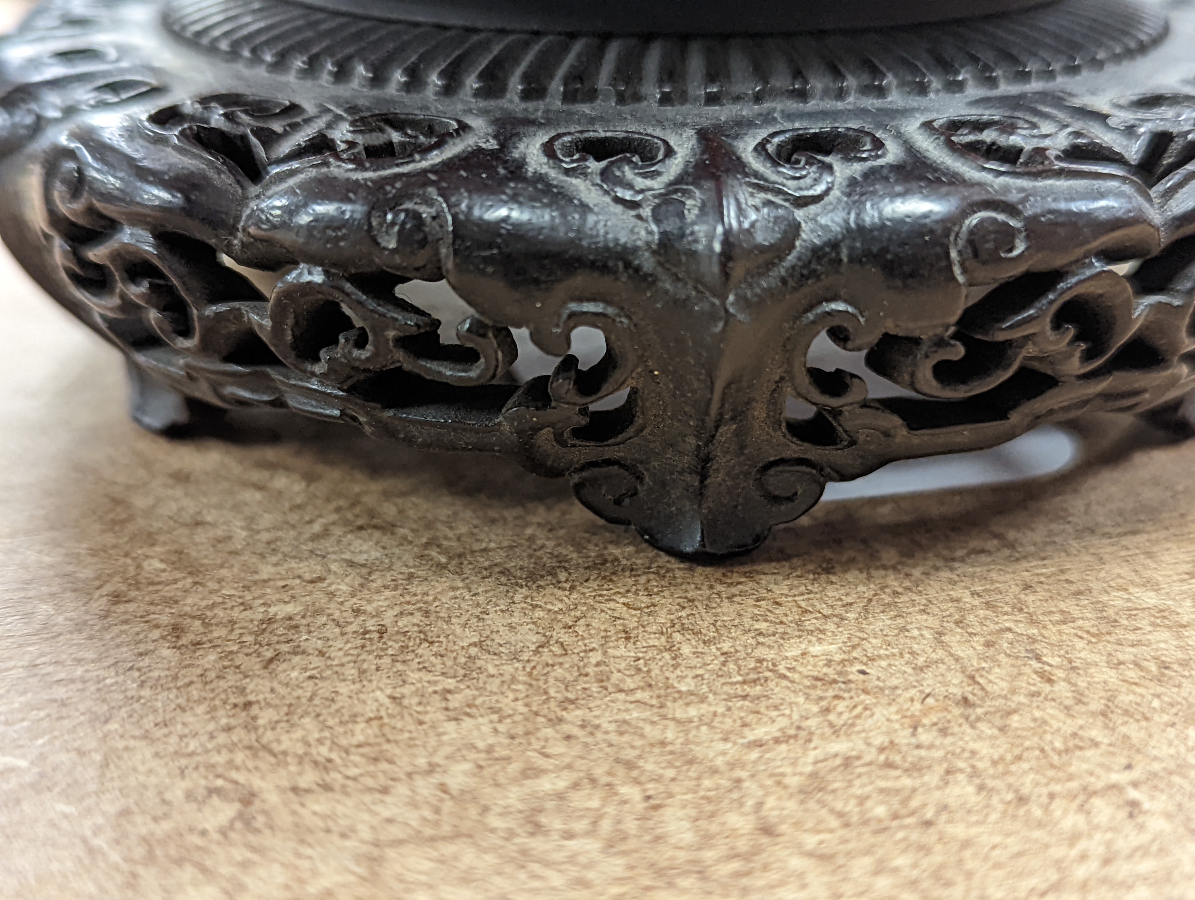 A fine 19th century Chinese hardwood stand, 11.4cm diameter